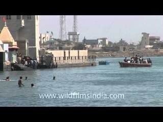 Devotees immerse in river Gomati, Dwarka