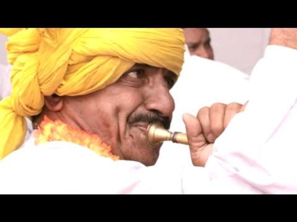 Drummers beating drum in parade ground, Mahavir Jayanti