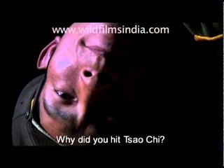 Tibetan boy getting thrashed by Chinese soldiers...