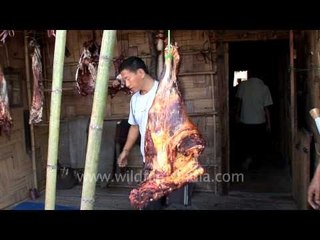 Slicing beef into chunks of meat