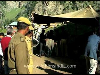 People passing through a security check point in Amarnath
