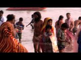 Devotees charge into the icy water at Ganga Sagar for a holy dip