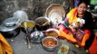 Kachari women enjoying kachari cuisines and local beer
