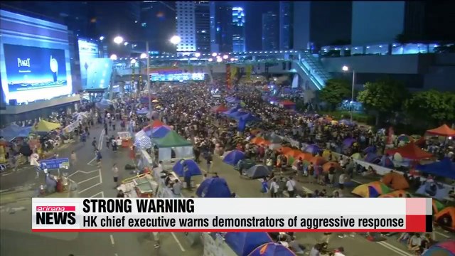 Hong Kong leader warns demonstrators of aggressive response