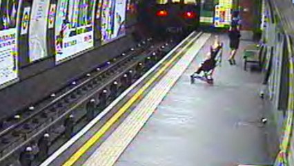 Baby Carriage Falls Onto Train Tracks