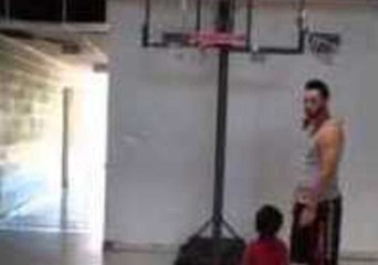 Man Blocks Small Boy's Basketball Shot in One Simple Swipe