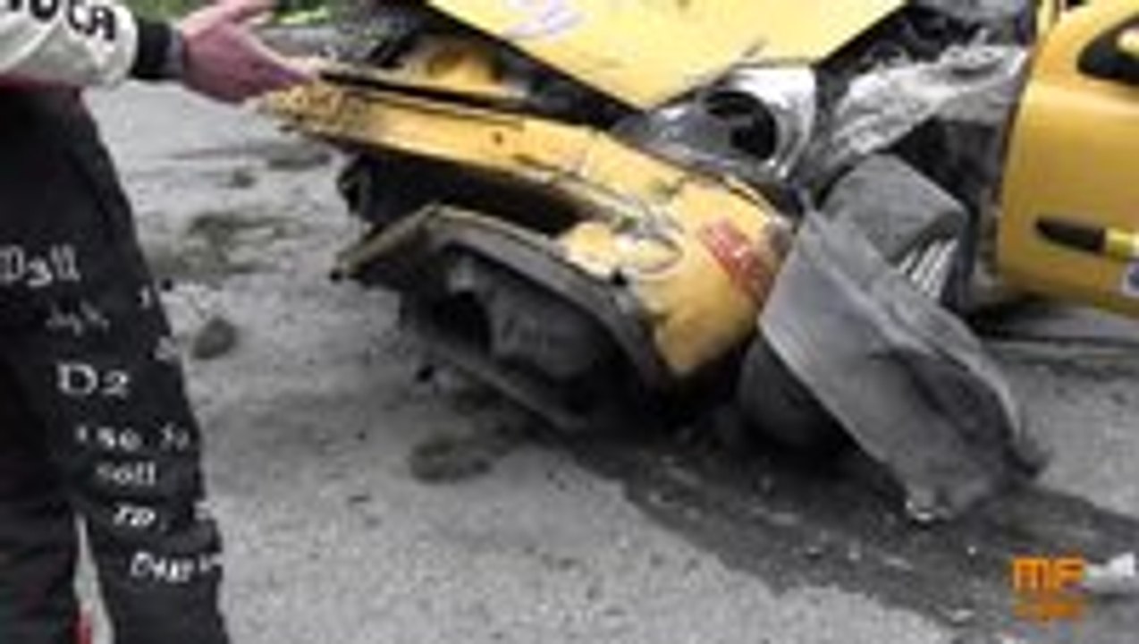 Race car flips over and nearly crashes into a group of people