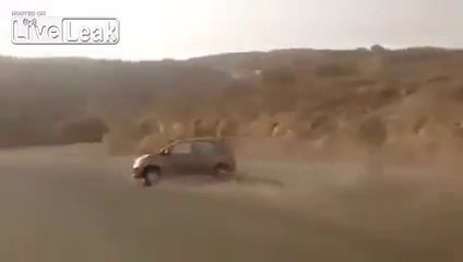 car skids and falls into ravine