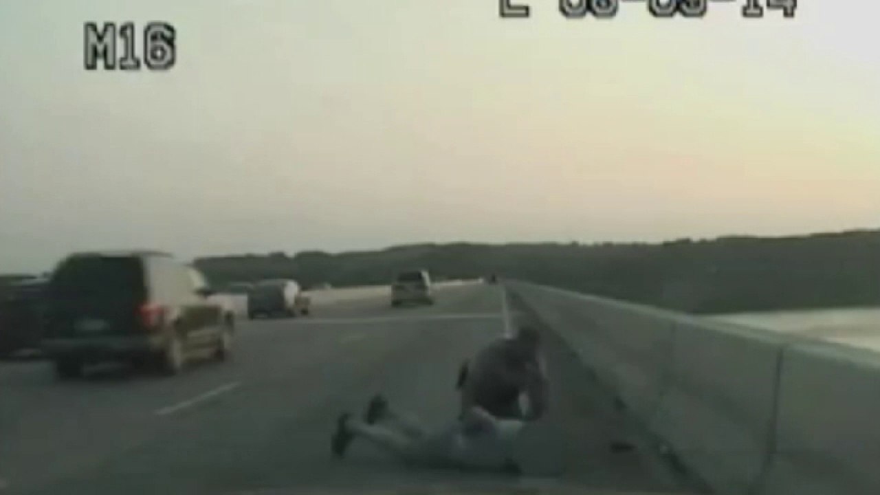 Incredible moment heroic cop stops apparent suicide attempt