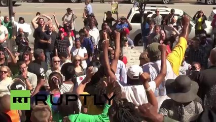 -Hands up, don't shoot- protesters march on Ferguson police dep