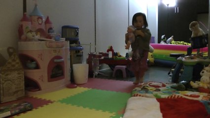 Girl Babysitting Her Doll