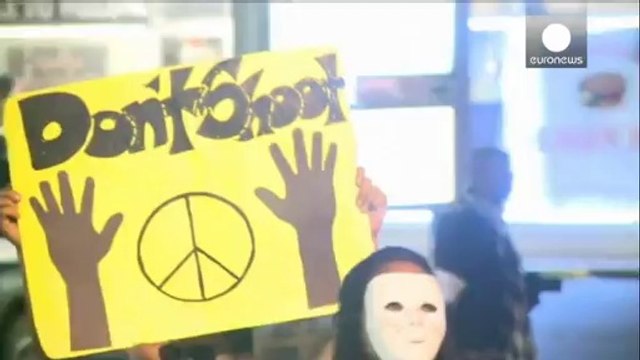 Ferguson curfew extended to second night as tensions mount over killing of unarmed teenager