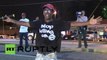 USA: Curfew defiant protesters surround looted gas station in Ferguson