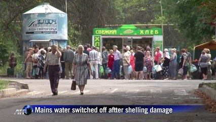 Donetsk residents queue for water after citywide shut-off