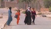 Residents return after Kurds retake Iraqi town from militants