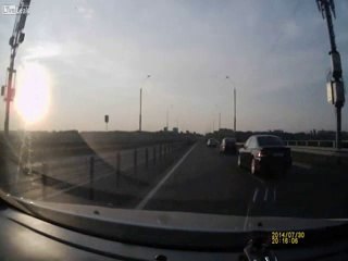 Motorcyclist Makes Insane Landing on roof of car After Crash