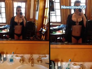 Kim Kardashian games with her curves in red hot bikini