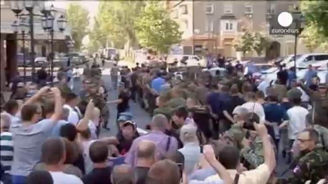 Captured Ukrainian soldiers marched through streets of Donetsk