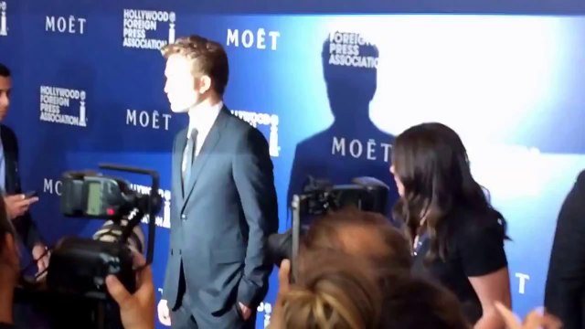 Robert Pattinson Poses on the HFPA Dinner Red Carpet 8-14-14