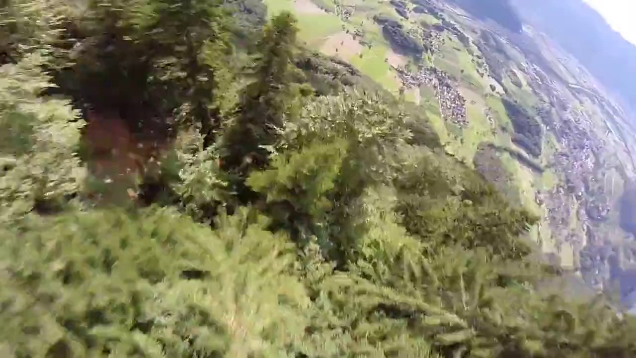 Wingsuit flight in the Alps, so so close to the trees!
