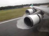 Boeing 747 landing after heavy rain with amazing Reverse Thrust Spray
