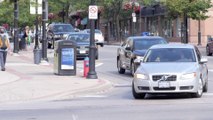 B-roll of pedestrians crossing streets, busy intersections and vehicle traffic