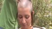 Woman shaves her own head to bald