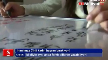 CHINA -  Amazing Girl writes with  two hands at the same time in different languages