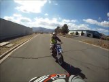 Guy drivng SUV wants to run over Dirtbike rider.