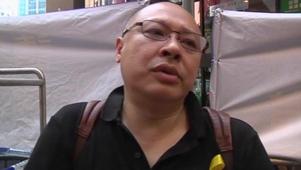 Black-clad pro-democracy protesters march in Hong Kong.