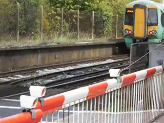 Class 377 passing Crawley Level Crossing 19th August 2011