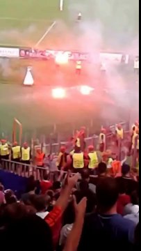 CSKA Moscow & Roma fans throw flares on each other during Champions League game