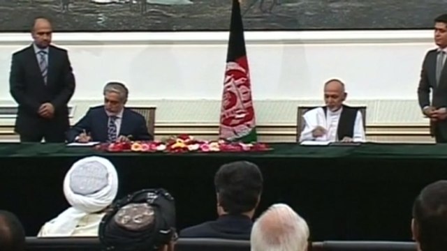 Afghan presidential rivals sign power-sharing deal