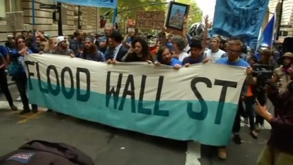 Climate change protesters march in New York's Financial District