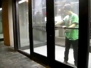 Drunk guy blocked outside vomits on himself