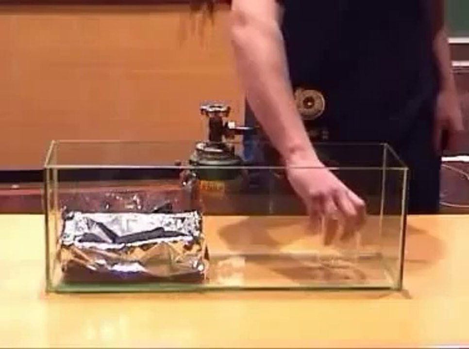 Model boat floating on sulphur hexafluoride