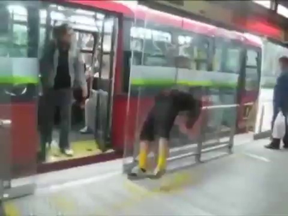 Drunk guy waits for the bus