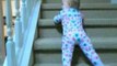 Little Girl Has Unique Way of Getting Herself Down the Stairs