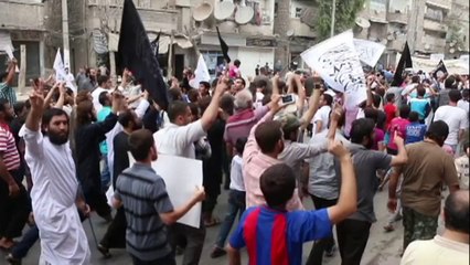 Al-Nusra Front supporters demonstrate against the US coalition