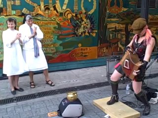 So crazy Punk girl playing Accordion in front of some nuns