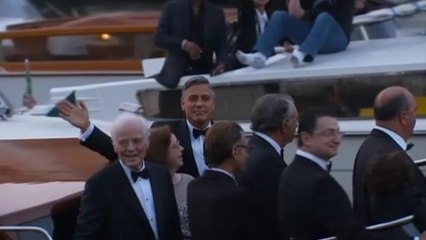 Clooney arrives by water taxi to his star studded Venice wedding
