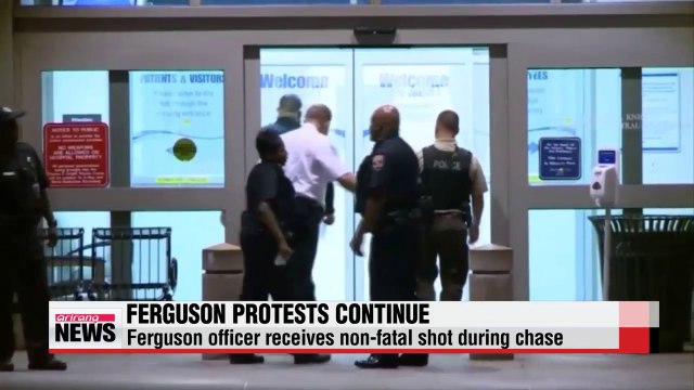 Ferguson protests continue after officer shot