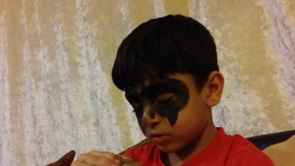 Cute sleepy Syrian child Adam resists and sings off-hand