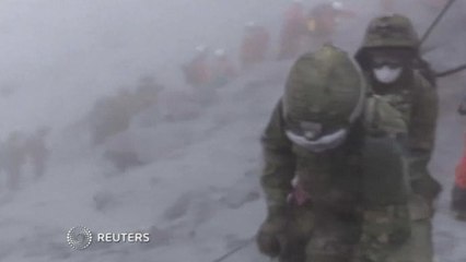 Japan stops volcano search due to bad weather