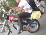 young boy and girl wheeling ..... no fear ......( Hidden Talent of Pakistan)