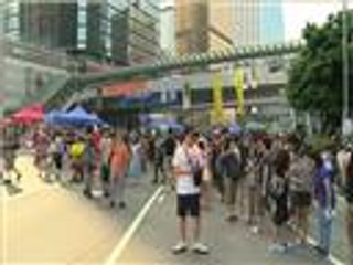 المحتجون يوافقون على تسهيل حركة الموظفين بهونغ كونغ