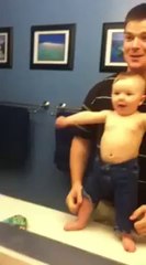 Baby Boy Loves Flexing In The Mirror With His Father