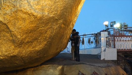 Prayers at the Golden Rock in Myanmar