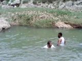 Zahid ustad is swiming in water in Mansoor Gahrh