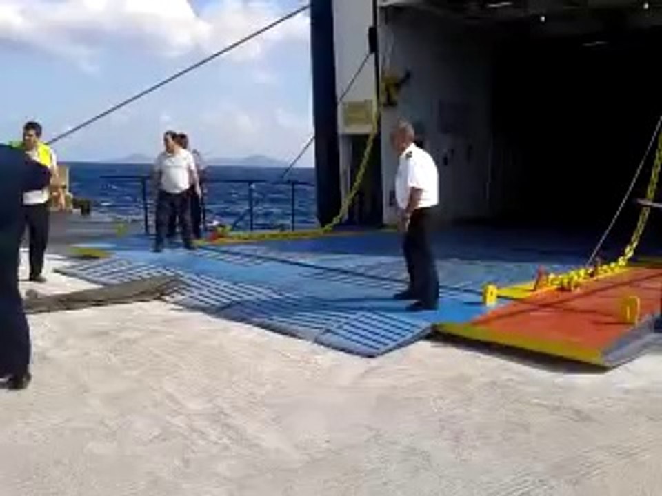 Load cars into ferry during heavy storm and giant waves! Crazy...